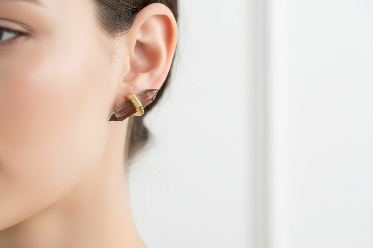 Model wearing horizontal smoky quartz crystal earrings