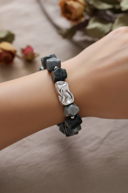 Model wearing dark grey jasper bracelet