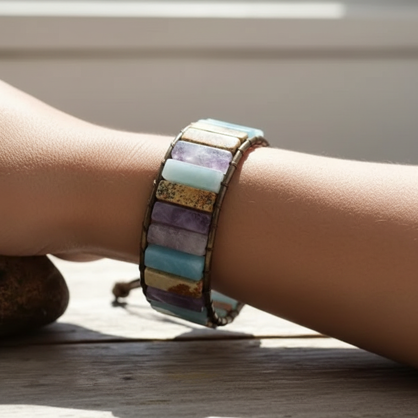 Model's wrist wearing gemstone wrap bracelet